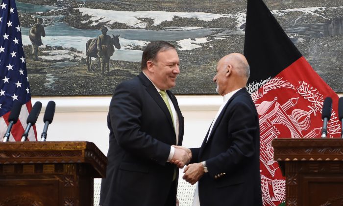 US Secretary of State Mike Pompeo (L) shakes hands with Afghan President Ashraf Ghani (R) after a press conference at the Presidential Palace in Kabul on July 9, 2018. U.S. Secretary of State Mike Pompeo made a surprise visit to Kabul on July 9 for talks with Afghan leaders, an Afghan official said, amid renewed optimism for peace in the war-weary country. (Photo by WAKIL KOHSAR / AFP)        (Photo credit should read WAKIL KOHSAR/AFP/Getty Images)