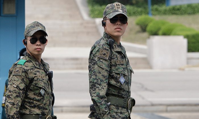 Two South Korean soldiers, unrelated to the reported case, stand guard at a border village of South Korea on May 13, 2012. (Chung Sung-Jun/Getty Images)