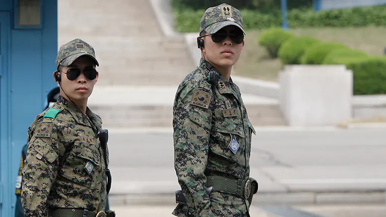 Two South Korean soldiers, unrelated to the reported case, stand guard at a border village of South Korea on May 13, 2012. (Chung Sung-Jun/Getty Images)