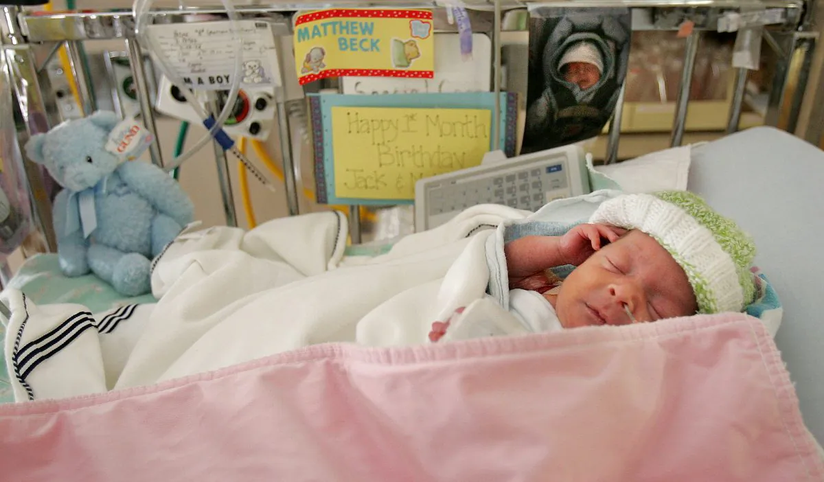 Premature baby Matthew Hirsh, born at 28 weeks, lies in the neonatal intensive care unit during a media tour for the March of Dimes' Prematurity Awareness Month at New York University Medical Center Nov. 10, 2004 in New York City. Because the United States, unlike other countries, includes premature babies in its calculation of infant mortality, statistics give a misleading picture of the nation’s health care. (Mario Tama/Getty Images)