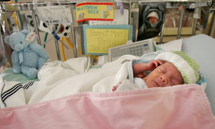 Premature baby Matthew Hirsh, born at 28 weeks, lies in the neonatal intensive care unit during a media tour for the March of Dimes' Prematurity Awareness Month at New York University Medical Center Nov. 10, 2004 in New York City. Because the United States, unlike other countries, includes premature babies in its calculation of infant mortality, statistics give a misleading picture of the nation’s health care. (Mario Tama/Getty Images)