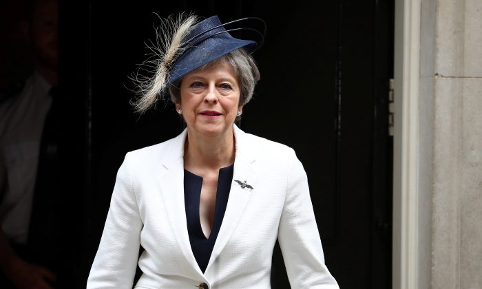 Britain's Prime Minister Theresa May leaves Downing Street in London, July 10, 2018. (Reuters/Hannah McKay)