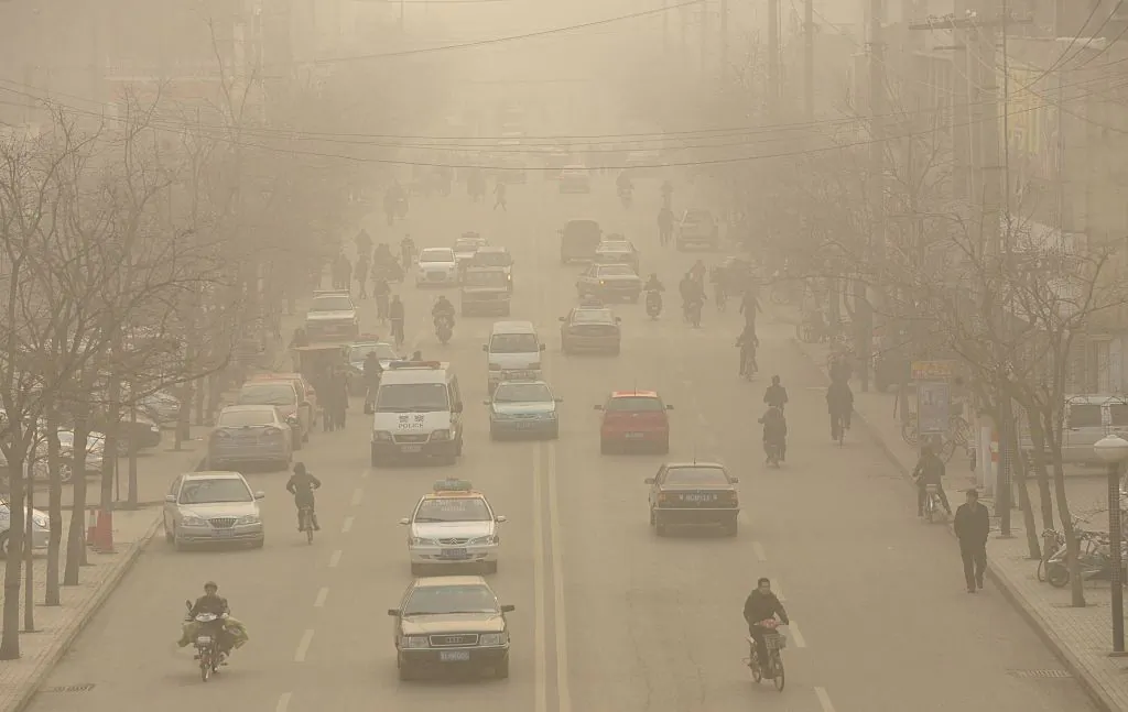 Smog down a main street of Linfen, a city in China's Shanxi Province, on Dec. 9, 2009. (Peter Parks/AFP/Getty Images)