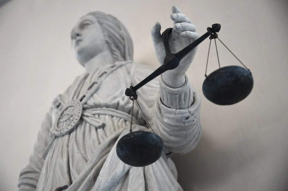 A statue depicting the goddess of Justice balancing the scales is seen at the Rennes' courthouse on May 19, 2015. (Damien Meyer/AFP/Getty Images)