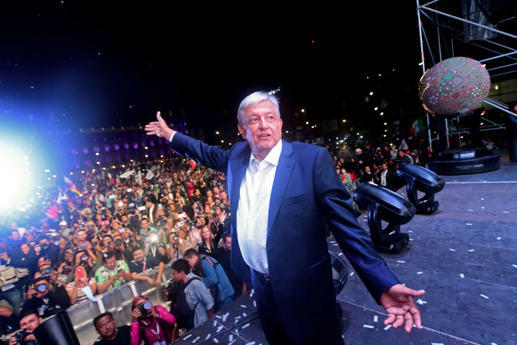 Newly elected Mexico's President Andrés Manuel López Obrador, running for the "Juntos haremos historia" party, cheers his supporters at the Zocalo Square after winning the general election, in Mexico City, Mexico on July 1, 2018. (PEDRO PARDO/AFP/Getty Images)