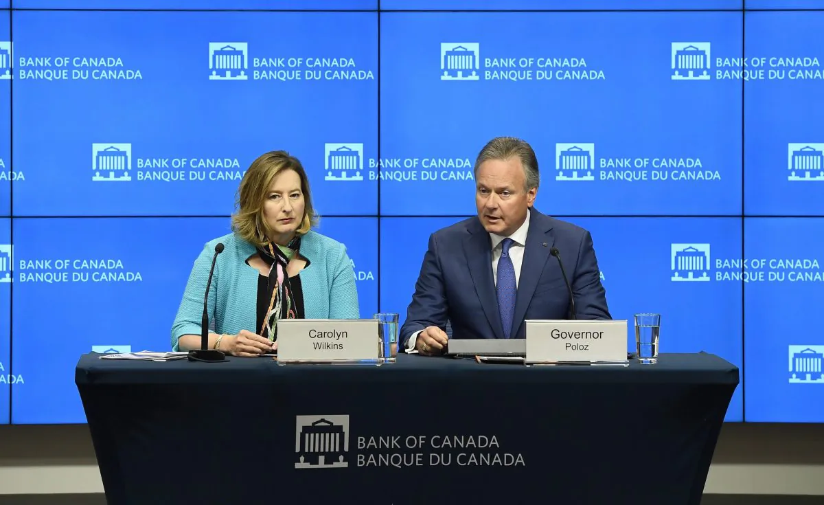 Governor of the Bank of Canada Stephen Poloz speaks as Senior Deputy Governor Carolyn Wilkins looks on after the central bank raised its overnight rate target to 1.5 percent in Ottawa on July 11, 2018. (The Canadian Press/Justin Tang)