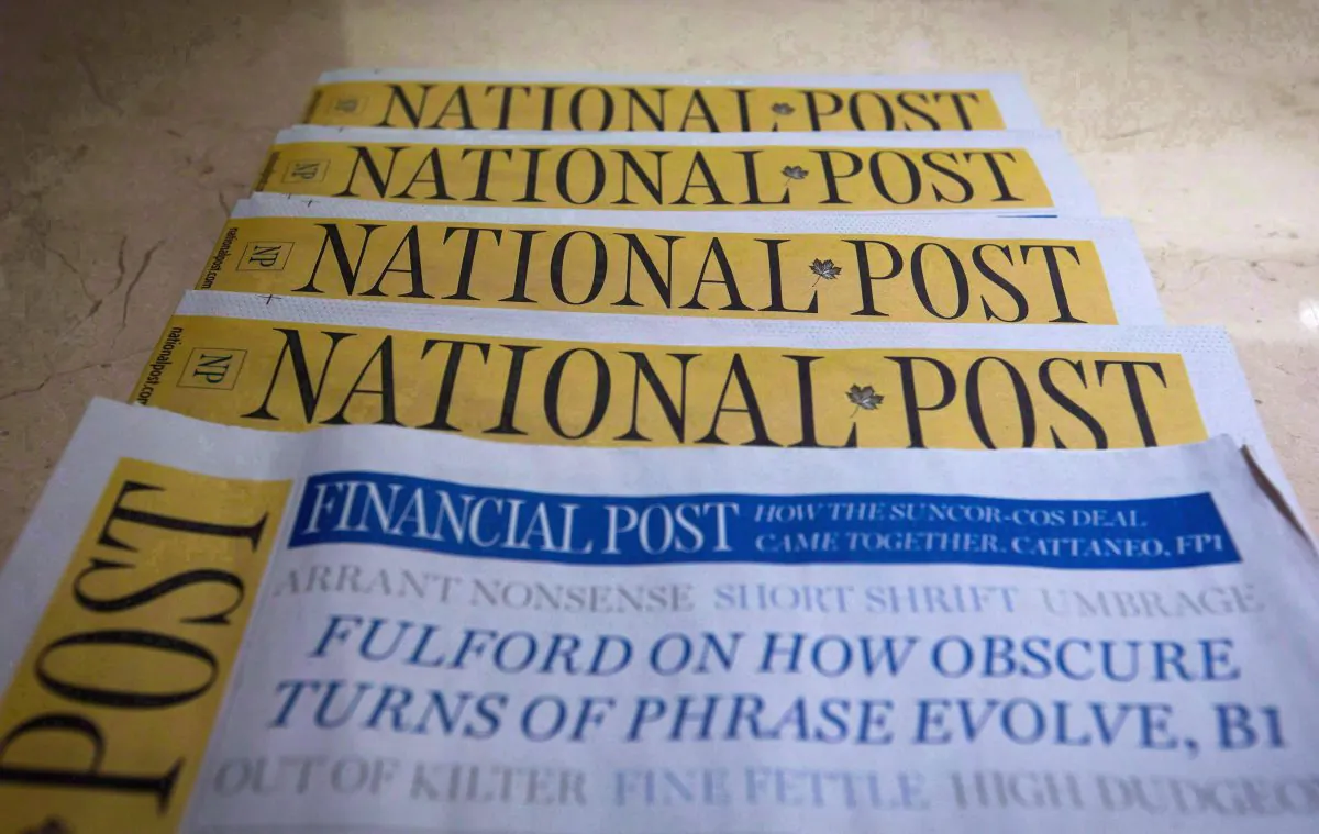 Copies of the Postmedia-owned National Post are displayed at a hotel in Burnaby, B.C. (The Canadian Press/Darryl Dyck)