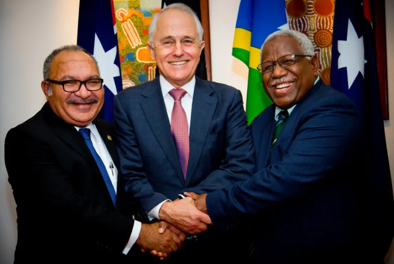 Australian Prime Minister Malcolm Turnbull poses for a photograph with Papua New Guinea Prime Minister Peter O'Neill (L) and Solomon Islands Prime Minister Rick Houenipwela (R) at the Brisbane Commonwealth Parliamentary Office in Brisbane, Australia, on July 11, 2018. (Patrick Hamilton/Reuters)