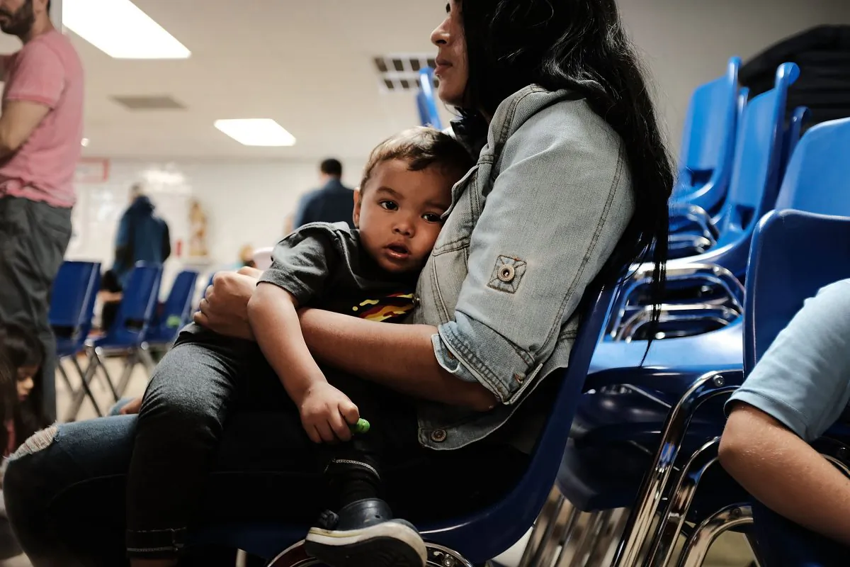A woman who sits with her son at the Catholic Charities Humanitarian Respite Center after recently crossing the U.S.–Mexico border in McAllen, Texas, on June 21, 2018. (Spencer Platt/Getty Images)