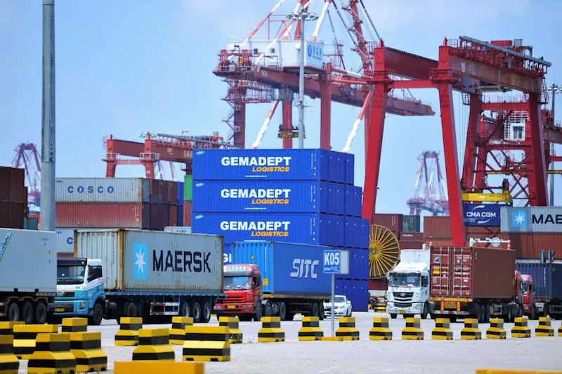 Containers are transferred at a port in Qingdao in China's eastern Shandong province on July 6, 2018.         (Photo credit should read -/AFP/Getty Images)