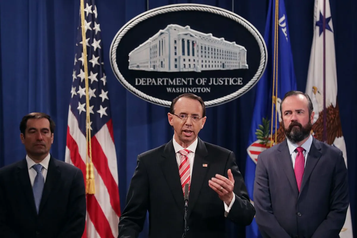 Deputy Attorney General Rod Rosenstein (C), Acting Principal Associate Deputy Attorney General Edward O'Callaghan (R) and Assistant Attorney General John Demers hold a news conference at the Department of Justice in Washington, on July 13, 2018. (Chip Somodevilla/Getty Images)