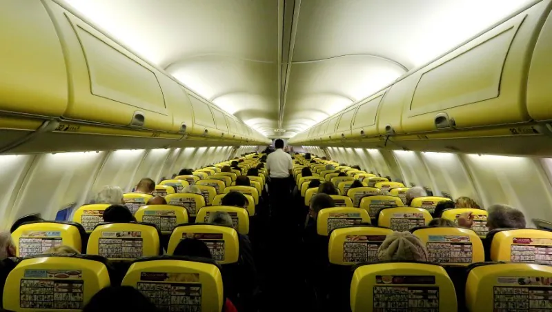A cabin crew member serves passengers onboard a Ryanair passenger aircraft travelling from Madrid International Airport to Bergamo Airport, Italy, Jan. 13, 2018. (REUTERS/Stefano Rellandini/File Photo)