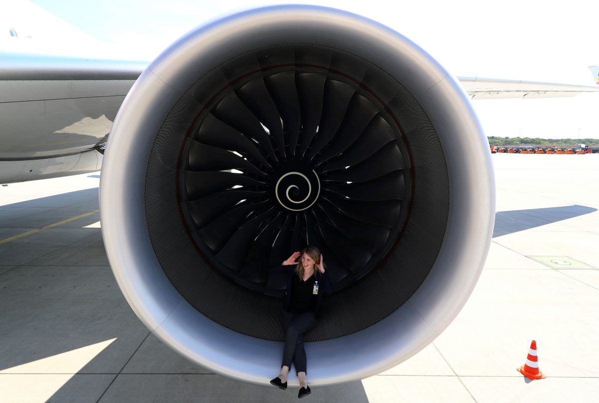 PR agent Elsa Goette sits in a Rolls-Royce engine of an Airbus A350-900 of Ethiopian Airlines during a site-inspection at Fraport airport in Frankfurt, Germany, May 22, 2017.  (REUTERS/Kai Pfaffenbach/File Photo)
