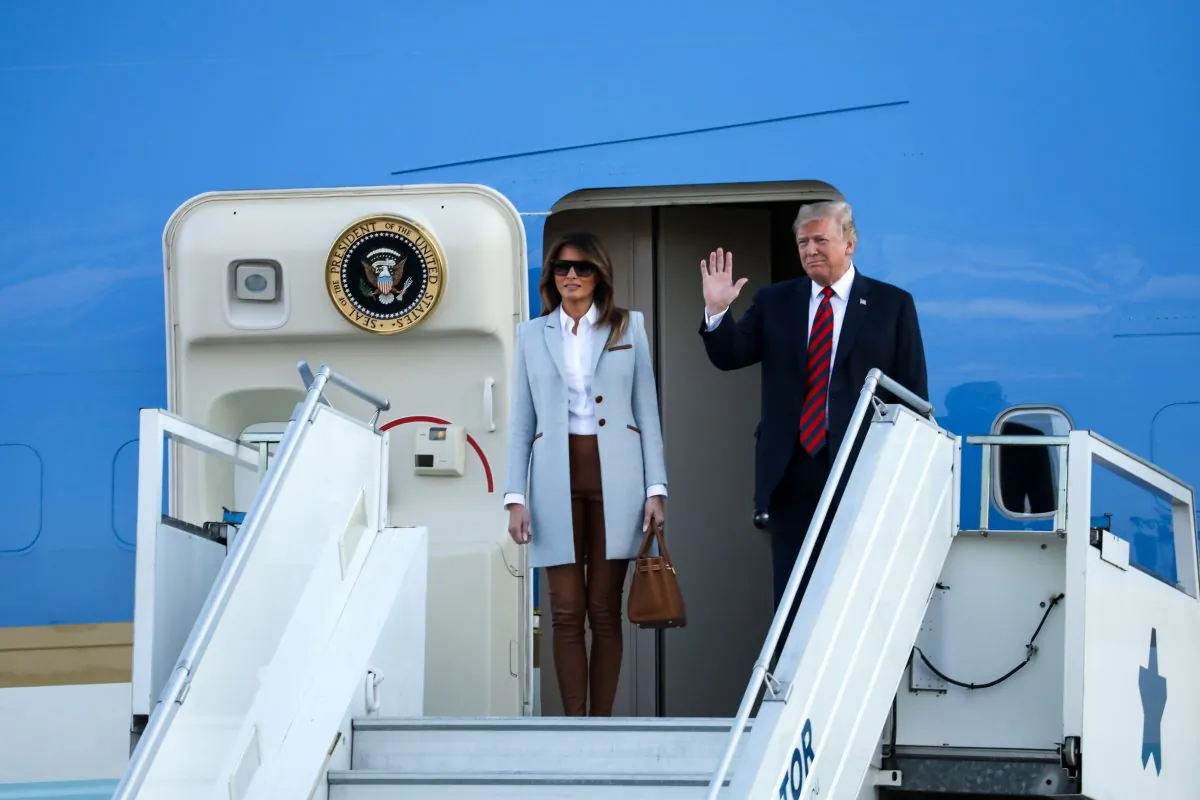 President Donald Trump and First Lady Melania Trump disembark from Air Force One at Helsinki Airport in Finland on July 15, 2018. (Samira Bouaou/The Epoch Times)
