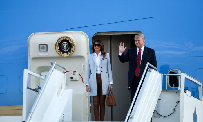 President Donald Trump and First Lady Melania Trump disembark from Air Force One at Helsinki Airport in Finland on July 15, 2018. (Samira Bouaou/The Epoch Times)