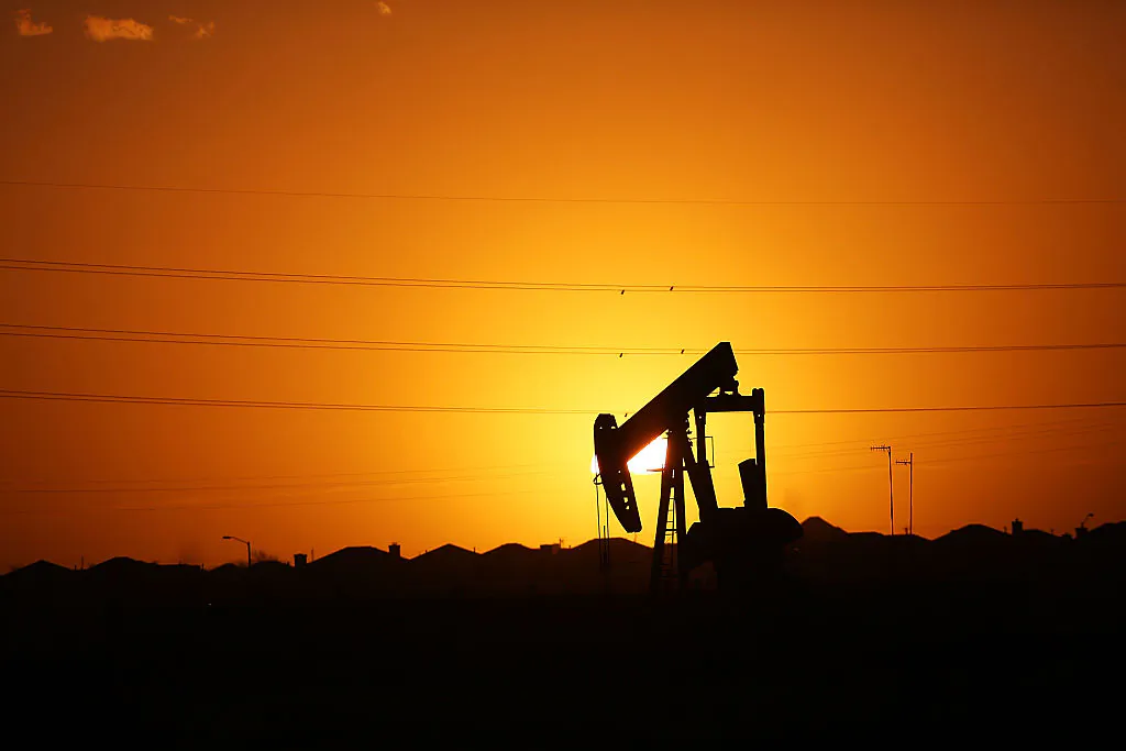 A pumpjack sits on the outskirts of town at dawn in the Permian Basin oil field in the oil town of Midland, Texas, on Jan. 21, 2016. (Spencer Platt/Getty Images)