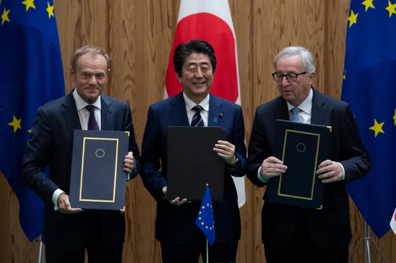 Japanese Prime Minister Shinzo Abe poses after signing a contract with European Commission President Jean-Claude Juncker and European Council President Donald Tusk at the Japanese Prime Minister's office in Tokyo, Japan, July 17, 2018. (Martin Bureau/Pool via Reuters)