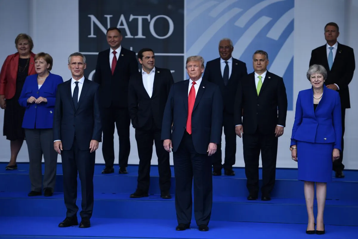 (Front row, L-R) NATO Secretary General Jens Stoltenberg, President Donald Trump, UK Prime Minister Theresa May, and other NATO heads of state pose for a group photo at the NATO headquarters in Brussels on July 11, 2018. (Brendan Smialowski/AFP/Getty Images)
