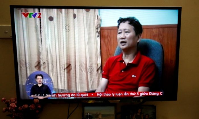 An image of Vietnamese former oil executive Trinh Xuan Thanh is seen on a TV screen on state-run television VTV, Aug. 3, 2017. (Reuters/Kham/File Photo)