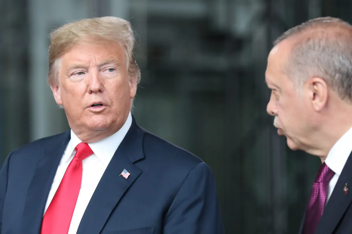 US President Donald Trump (L) talks with Turkeys President Recep Tayyip Erdogan (R) at NATO headquarters in Brussels during the NATO (North Atlantic Treaty Organization) summit on July 11, 2018. (TATYANA ZENKOVICH/AFP/Getty Images)
