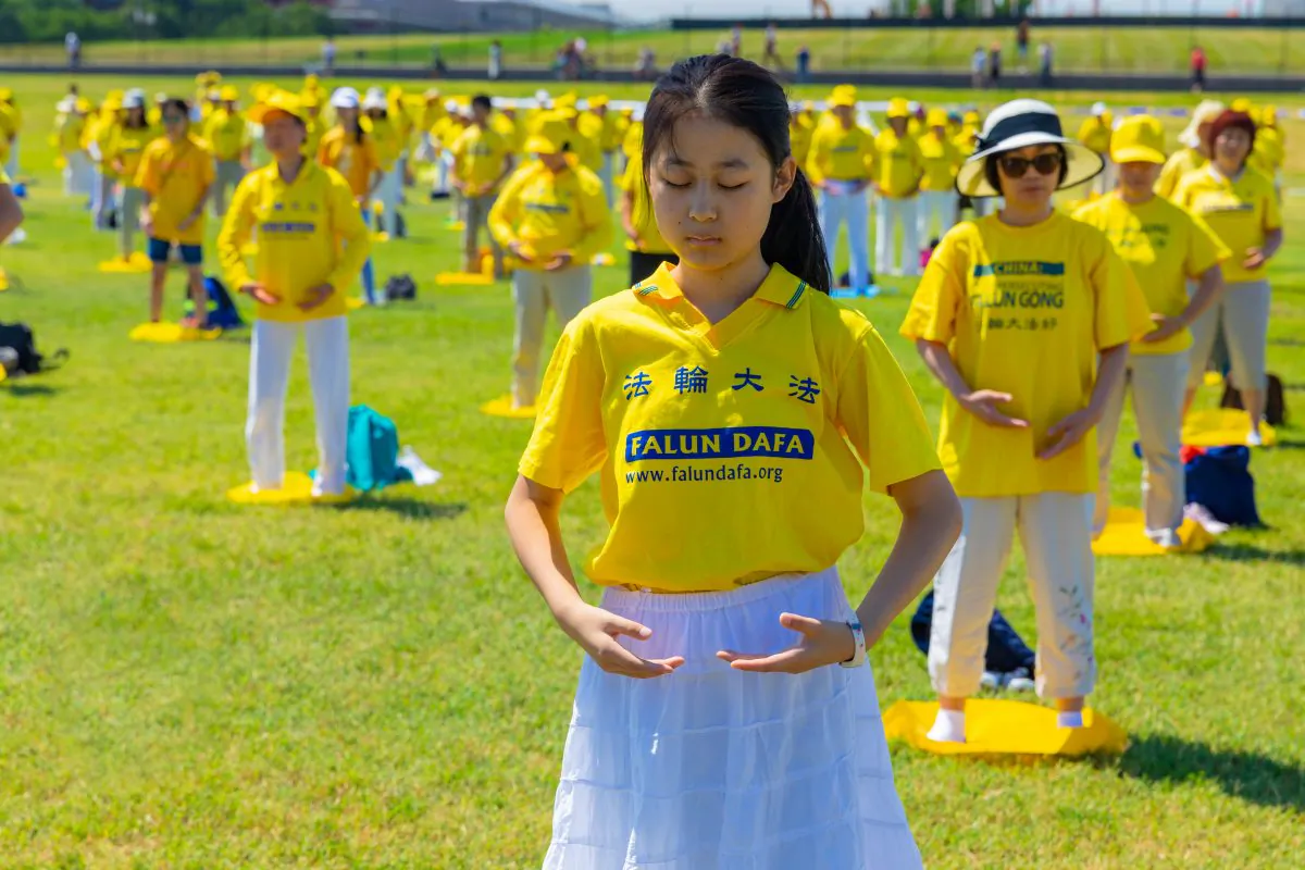 Falun Gong practitioners demonstrate their discipline's exercises in Washington on July 19, 2018. (Mark Zou/Epoch Times)
