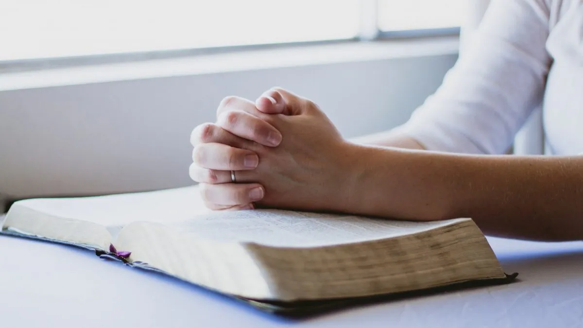 A woman praying. The word hypocrite has taken on a new meaning in modern times, becoming a criticism for anyone who does something that goes against their moral beliefs. But that is not what is means. (reenablack/pixabay)