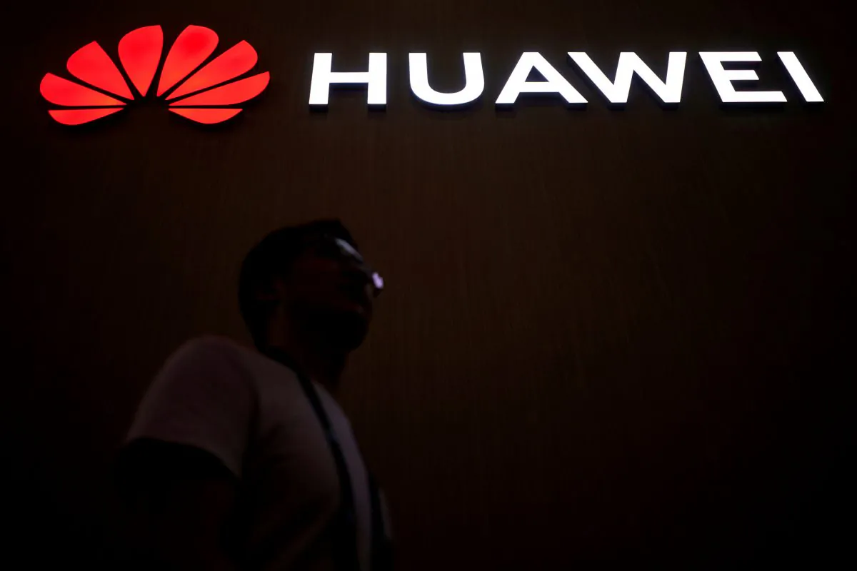 A man walks past a sign board of Huawei at the Consumer Electronics Show Asia 2018 in Shanghai, China, June 14, 2018. (Aly Song/Reuters/File Photo)