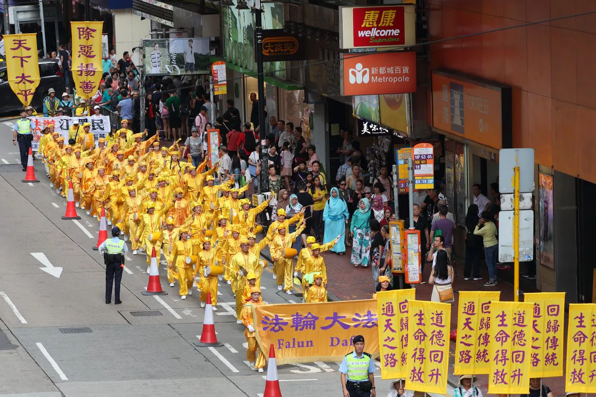 Falun Gong practitioners at a march in Hong Kong to protest Beijing’s persecution of adherents in mainland China, on July 22, 2018. (Song Bilong/The Epoch Times)