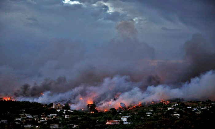 A wildfire rages in the town of Rafina, near Athens, Greece, July 23, 2018. (Reuters/Alkis Konstantinidis)