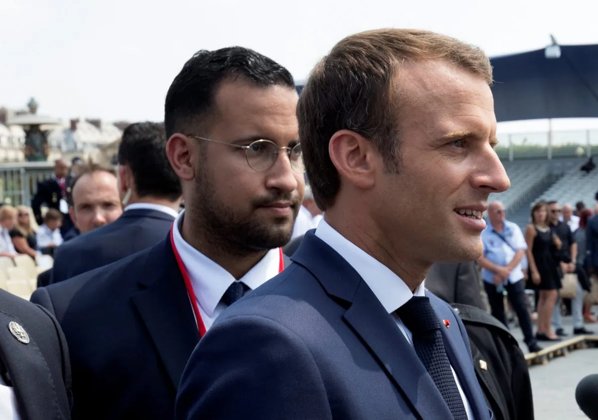 French President Emmanuel Macron walks ahead of his aide Alexandre Benalla at the end of the Bastille Day military parade in Paris, France, July 14, 2018. (Reuters/Philippe Wojazer/Pool)