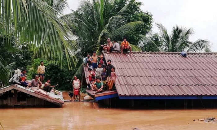 Villagers evacuate after the Xepian-Xe Nam Noy hydropower dam collapsed in Attapeu province, Laos July 24, 2018.   (ABC Laos News/Handout via REUTERS)
