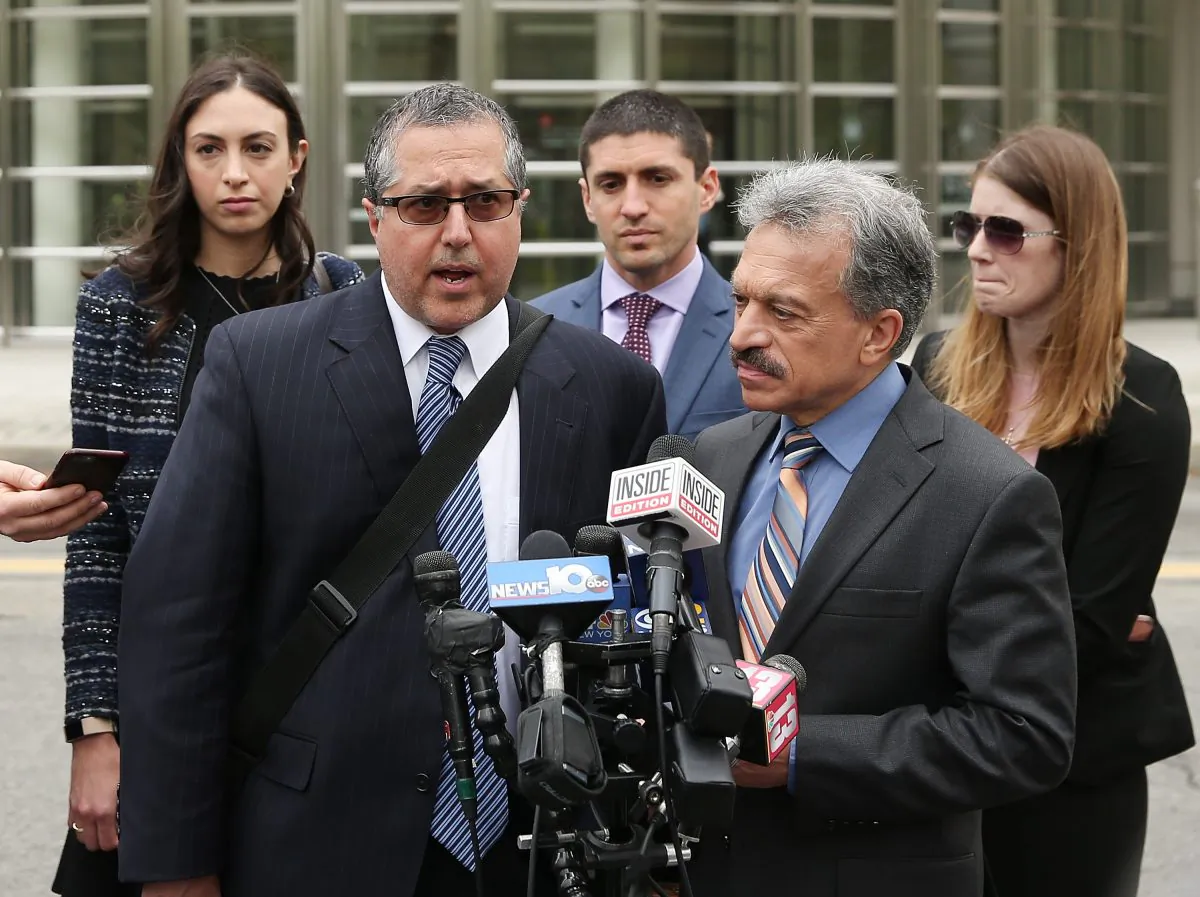 Legal Council representing Keith Raniere and the group NXIVM Mark Agnifilo and Paul DerOhannesian speak to the media outside the United States Eastern District Court after a bail hearing for actress Allison Mack and NXIVM founder Keith Raniere in relation to the sex trafficking charges in the Brooklyn borough of New York City on May 4, 2018. (Jemal Countess/Getty Images)