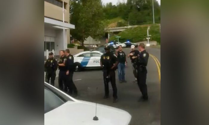 Police outside the Immigration and Customs Enforcement (ICE) building in Portland, Oregon. (Bryant King via Storyful)