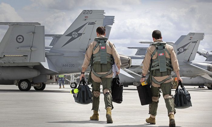 File photo of F/A-18F Super Hornet aircrew members heading to their aircraft in preparation for departure to the Middle East from RAAF Base Amberley on September 21, 2014 in Amberley, Australia. (Photo by CPL Ben Dempster/Royal Australian Air Force via Getty Images)
