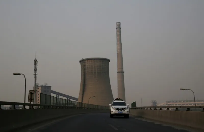 A vehicle drives past a closed factory on a polluted day after the Chinese Lunar New Year holidays in Beijing, China, on February 3, 2017. (Jason Lee/Reuters)