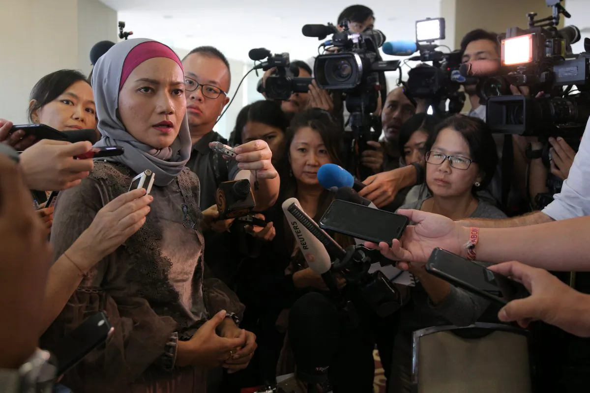 A family member speaks to the media after an MH370 briefing closed door meeting in Putrajaya, Malaysia July 30, 2018. (Reuters/Sadiq Asyraf)