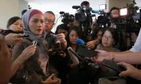 No New Findings in MH370 Probe Report, Families Say