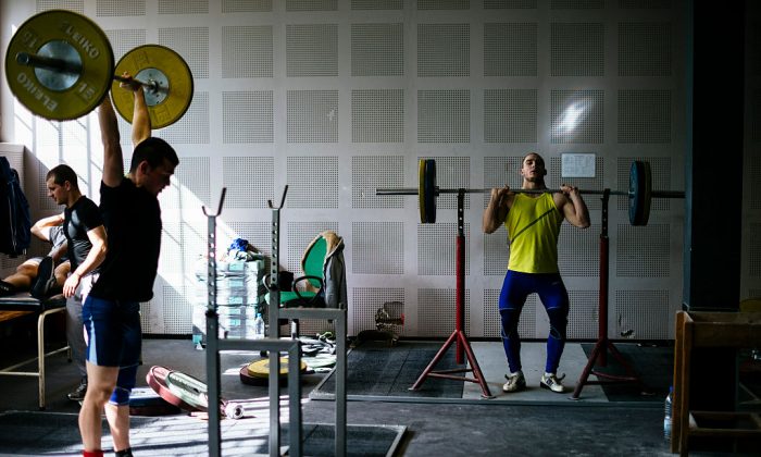 Athletes lift weights during a training session at the Bulgaria's national weightlifting centre in Sofia on March 26, 2016.
 (Dimitar Dilkoff/AFP/Getty Images)