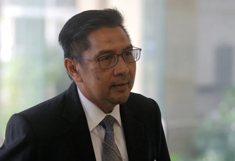 Director General of Civil Aviation Malaysia, Azharuddin Abdul Rahman, arrives for an MH370 meeting in Putrajaya, Malaysia July 30, 2018.  (REUTERS/Sadiq Asyraf)