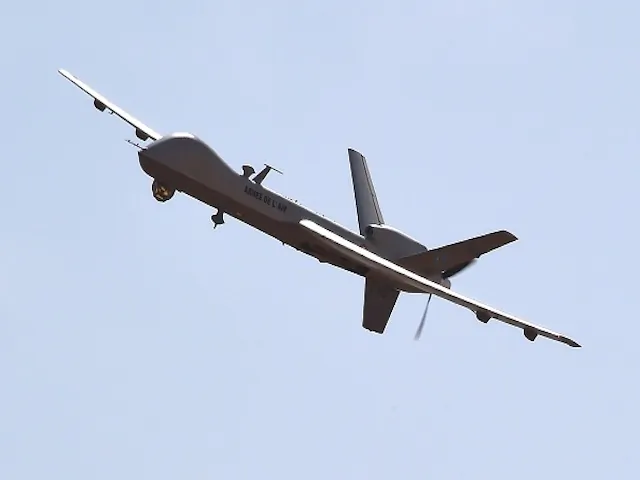 A U.S.-made Reaper drone, part of Operation Barkhane's aerial detachment, flies over the Nigerian military airport Diori Hamani in Niamey on Jan. 2, 2015. (Dominique Faget/AFP/Getty Images)
