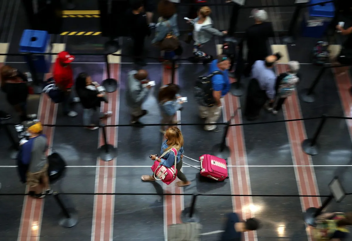 Travelers move through one of the Transportation Security Administration lines at Ronald Reagan National Airport's Terminal B and C September 1, 2017 in Washington, DC. (Chip Somodevilla/Getty Images)
