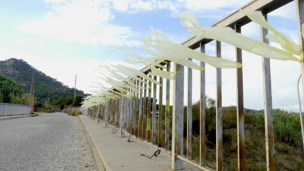 Yellow ribbons decorating railings in a street in Cabrera de Mar, near Barcelona, Spain, on Aug. 29, 2018. (Anna Llado/Special to The Epoch Times)