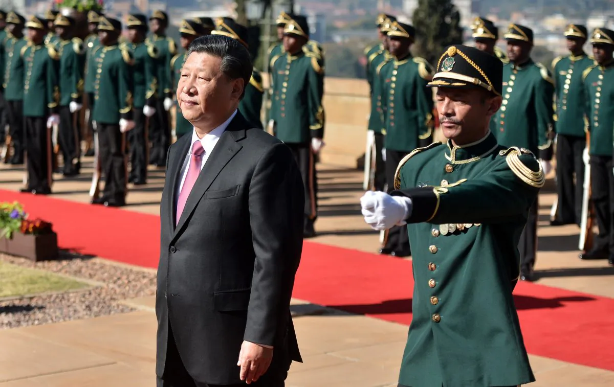 Chinese leader Xi Jinping inspects a military honor guard during an official state visit, at the Union Building in Pretoria, South Africa, on July 24, 2018. (Phill Magakoe/AFP/Getty Images)