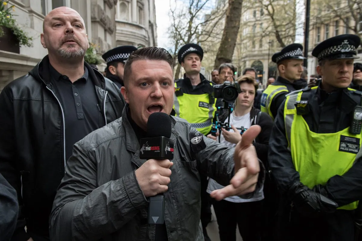 Tommy Robinson is escorted by police during a protest on April 1, 2017 in London, England. (Chris J Ratcliffe/Getty Images)