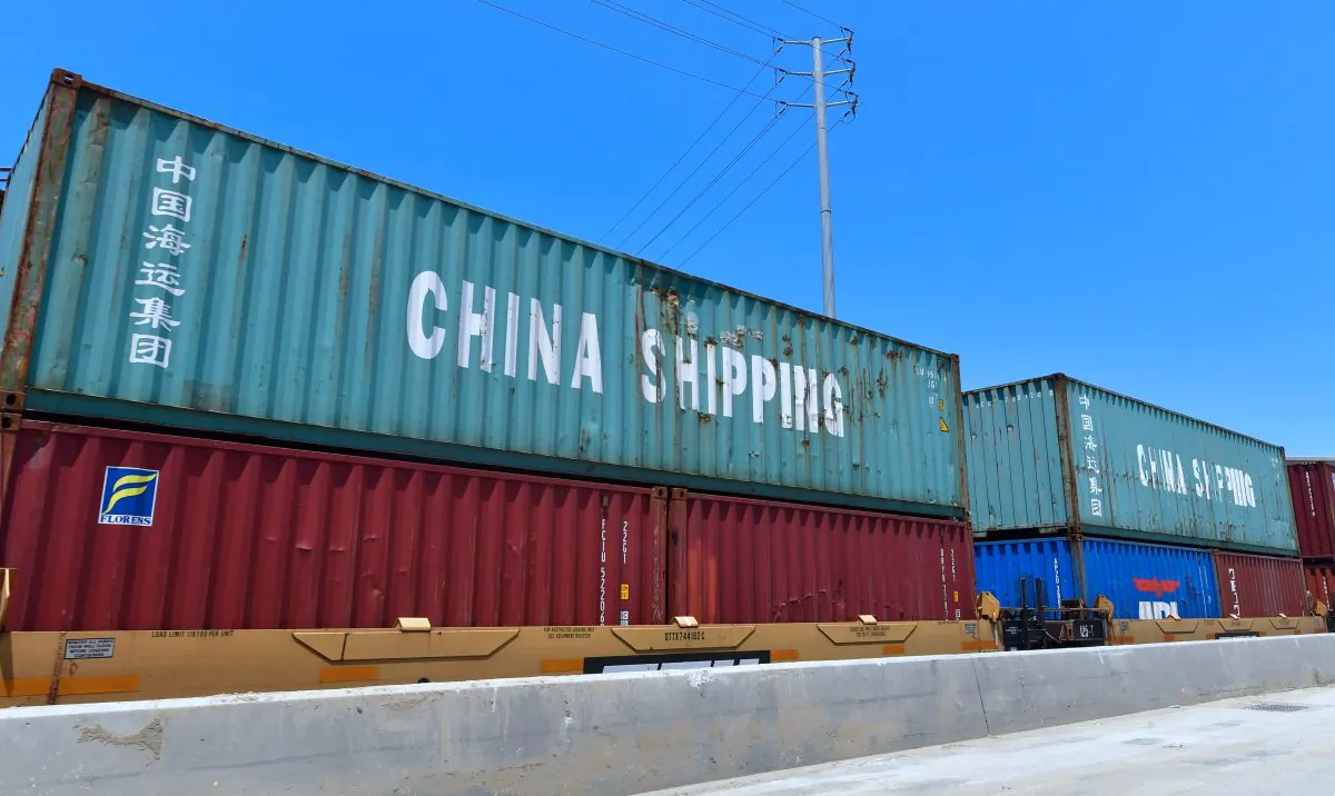 Shipping containers, including those of China Shipping, a shipping conglomerate under direct administration of China'a State Council, await transportation on a rail line at the Port of Long Beach on July 12, 2018 in Long Beach, California. (Frederic Brown/AFP/Getty Images)