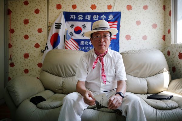 Vietnam War veteran Chung Seung-jin poses for photographs after an interview with Reuters at his home in Suwon, South Korea, July 31, 2018.