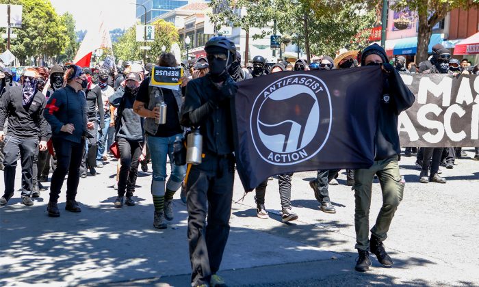 Antifa militants march with counter protesters, opposing alt-right rally in Berkeley, Aug. 5, 2018. (Amy Osborne/AFP/Getty Images)
