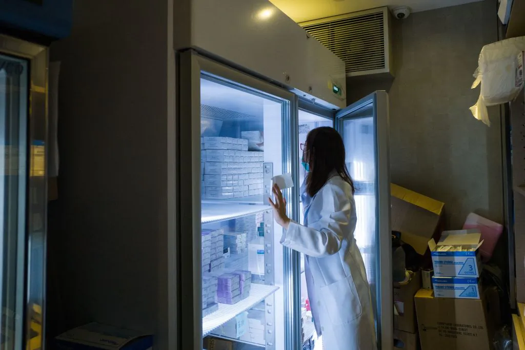 A nurse looks for vaccines at a private clinic that performs vaccinations in Hong Kong on July 24, 2018. (Anthony Wallace/AFP/Getty Images)