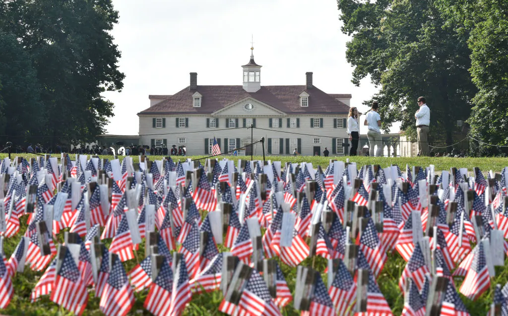 A field of US flags are seen in front of George Washington's Mount Vernon estate during Independence Day celebrations in Mount Vernon, Virginia, on July 4, 2018. (Mandel Ngan/AFP/Getty Images)