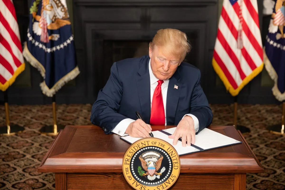 President Donald J. Trump signs an EO on Iran Sanctions in the Green Room at Trump National Golf Club on Aug. 5, 2018, in Bedminster Township, New Jersey.  (Official White House Photo by Shealah Craighead)